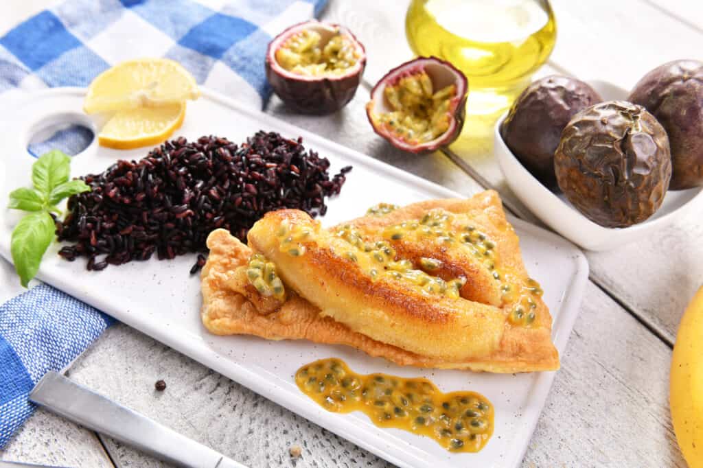 Traditional madeira dish - scabbardfish with bananas and passion fruit